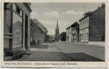 AK Heiligenhaus Bezirk Düsseldorf Hauptstraße mit Postamt u. kath. Pfarrkirche 1953